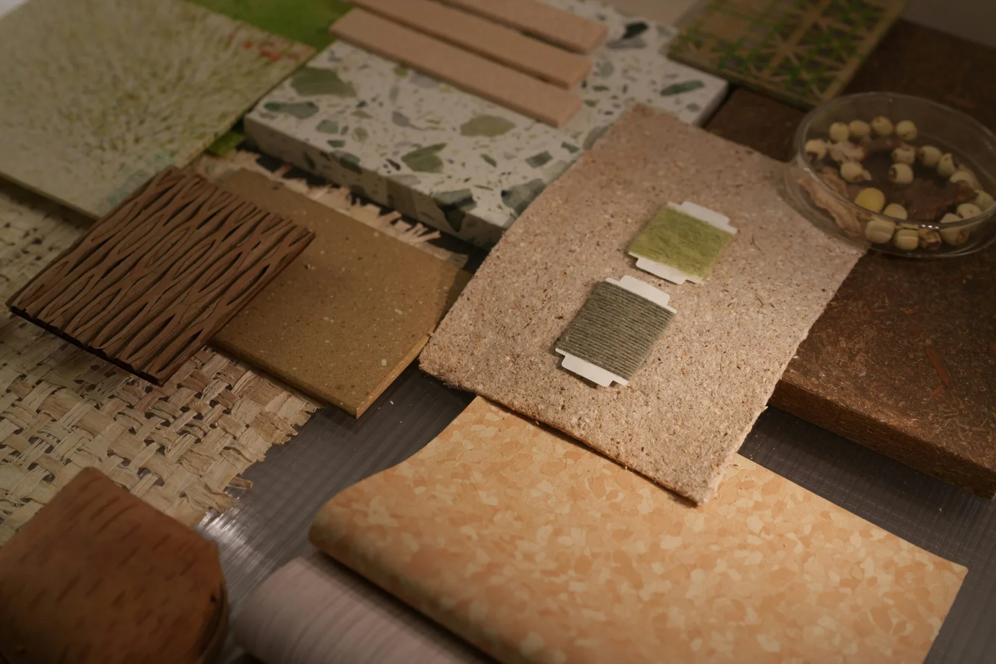 Stone, timber, tile and fabric samples laid out for one scheme
